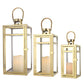 Bougeoir lanterne en métal en acier inoxydable de 19'', 15'' et 12'' H avec panneaux en verre transparent (lot de 3 dorés)