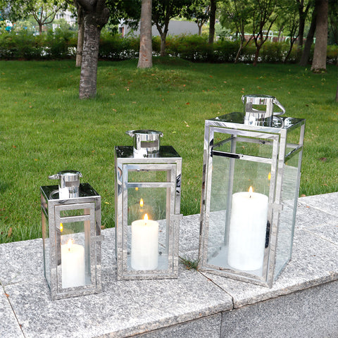 Bougeoir lanterne en métal en acier inoxydable de 19 po, 15 po et 12 po de hauteur avec panneaux en verre transparent (Ensemble de 3)